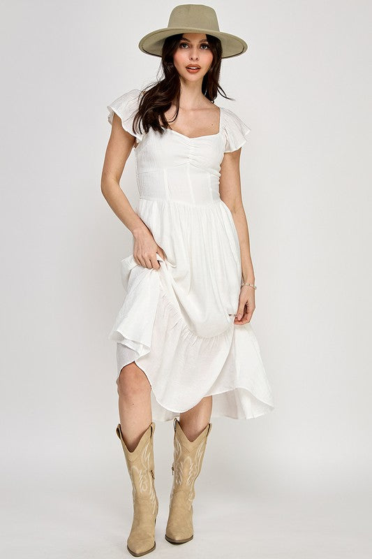 Woman wearing a dress on a white background