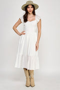 Woman wearing a dress on a white background