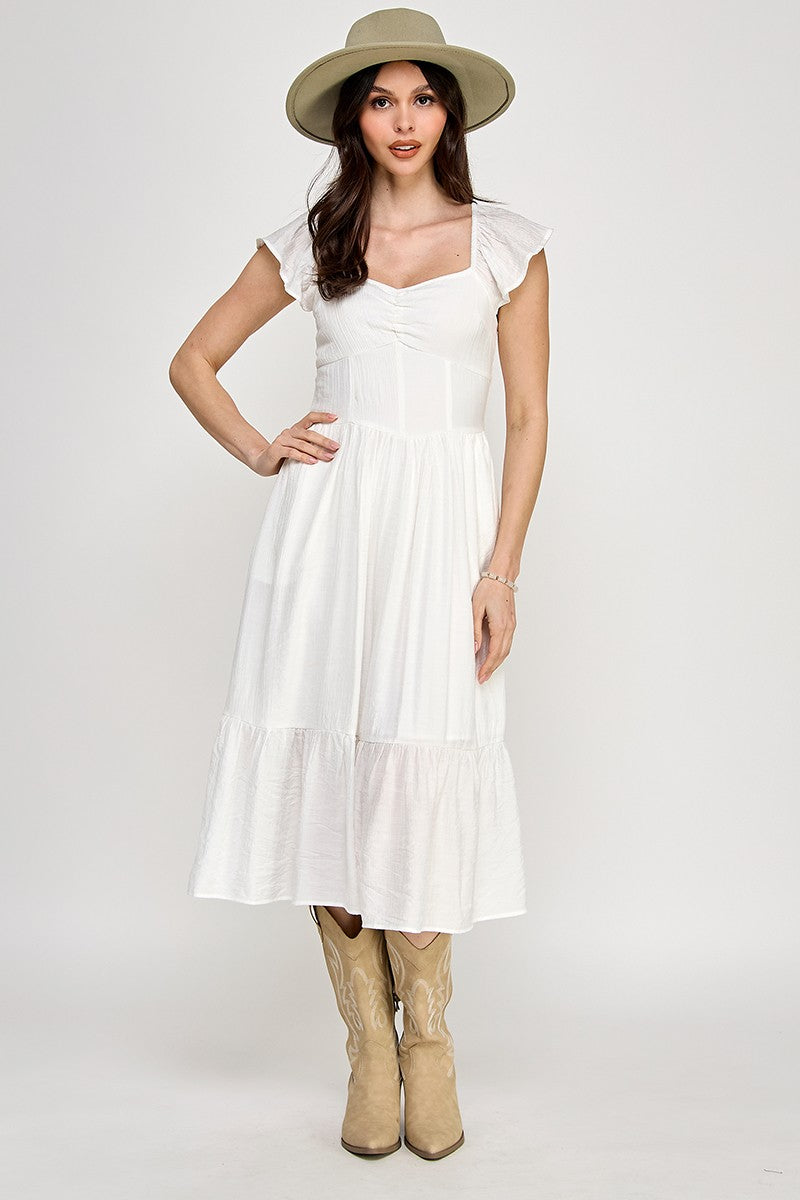 Woman wearing a dress on a white background