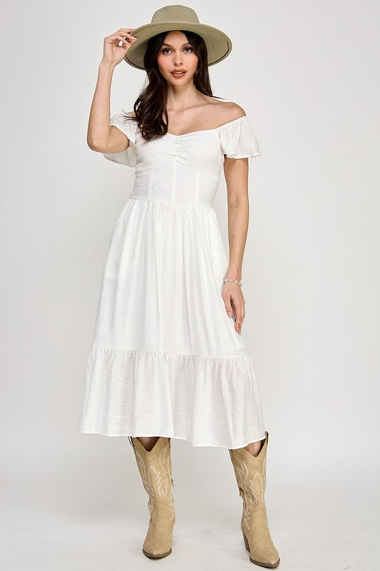 Woman wearing a dress on a white background