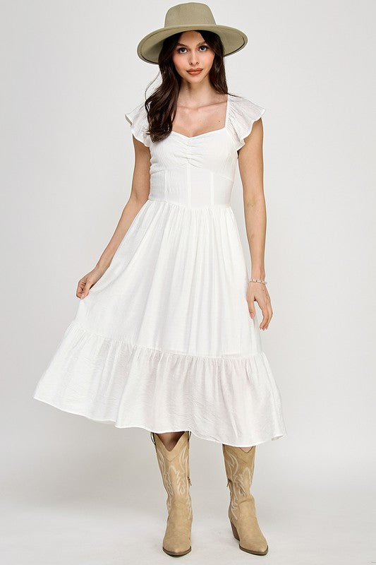 Woman wearing a dress on a white background