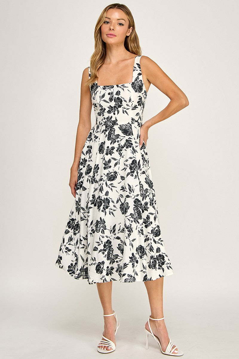 Woman wearing a floral dress on a white background