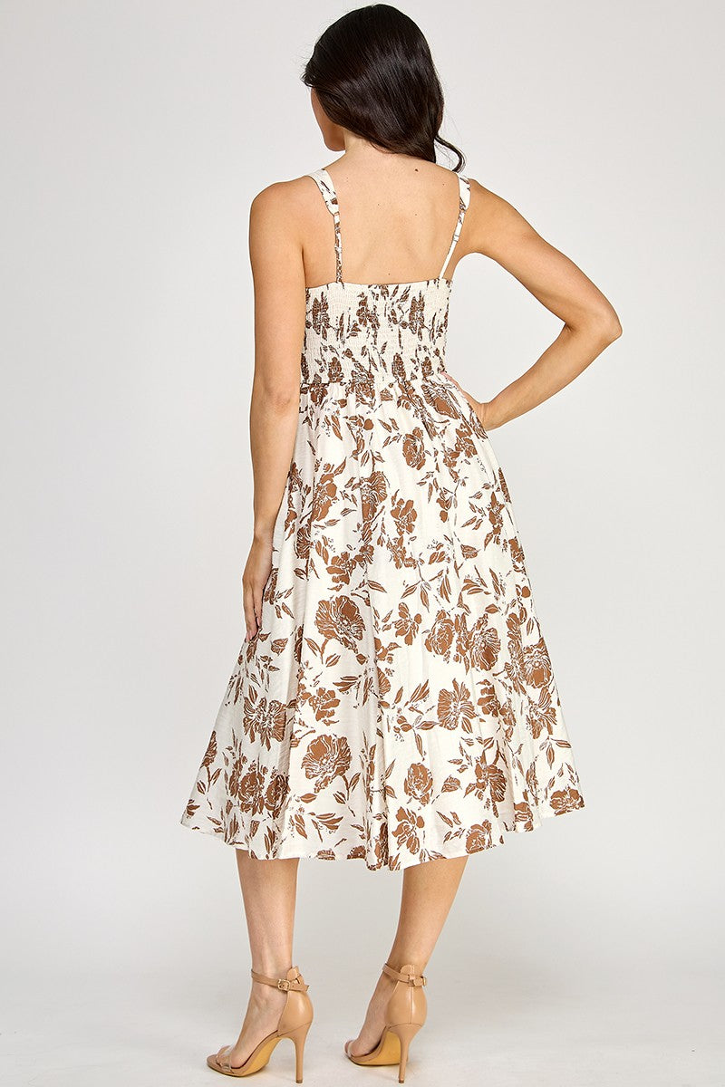 Woman wearing a floral dress on a white background