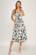 Woman wearing a floral dress on a white background