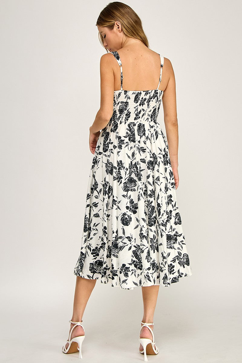 Woman wearing a floral dress on a white background