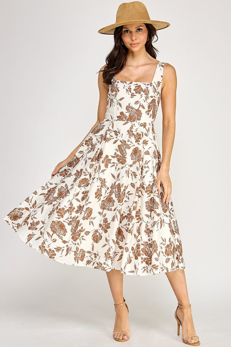 Woman wearing a floral dress on a white background