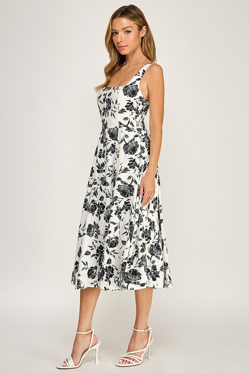 Woman wearing a floral dress on a white background