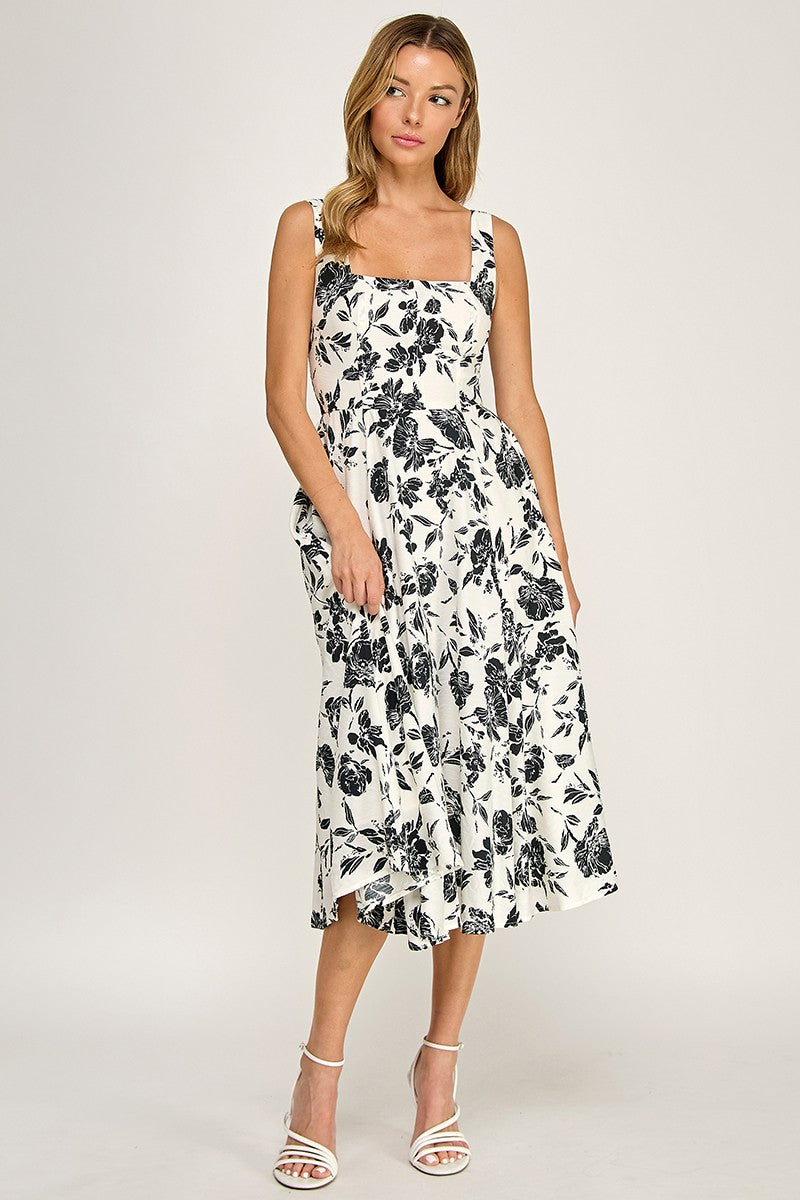Woman wearing a floral dress on a white background