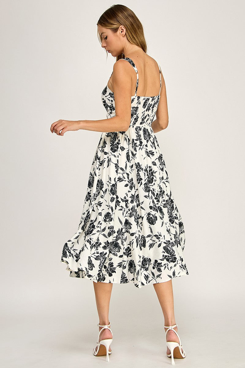 Woman wearing a floral dress on a white background