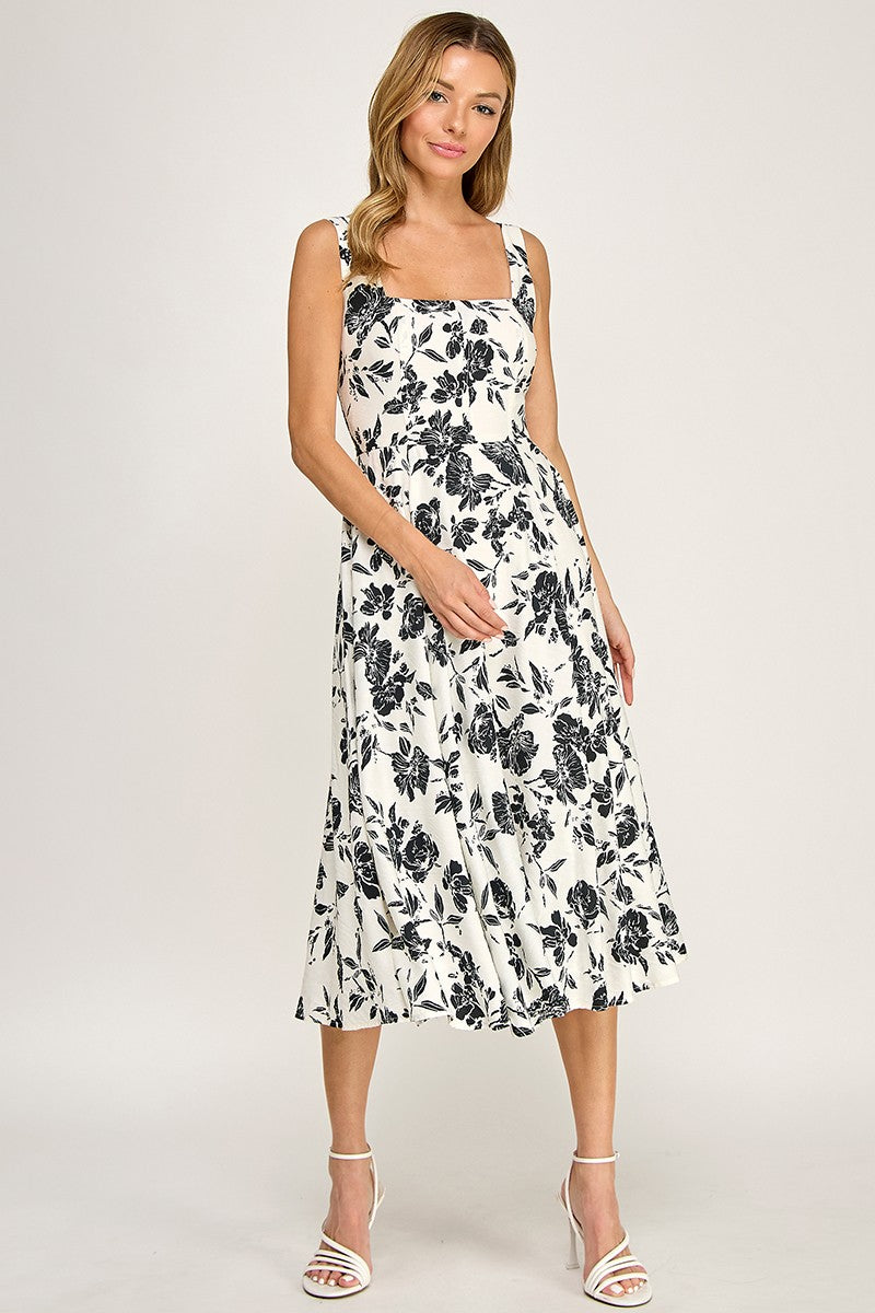 Woman wearing a floral dress on a white background