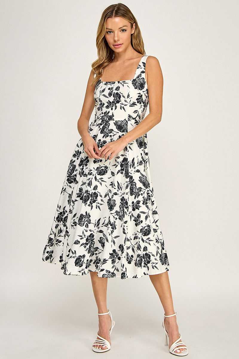 Woman wearing a floral dress on a white background