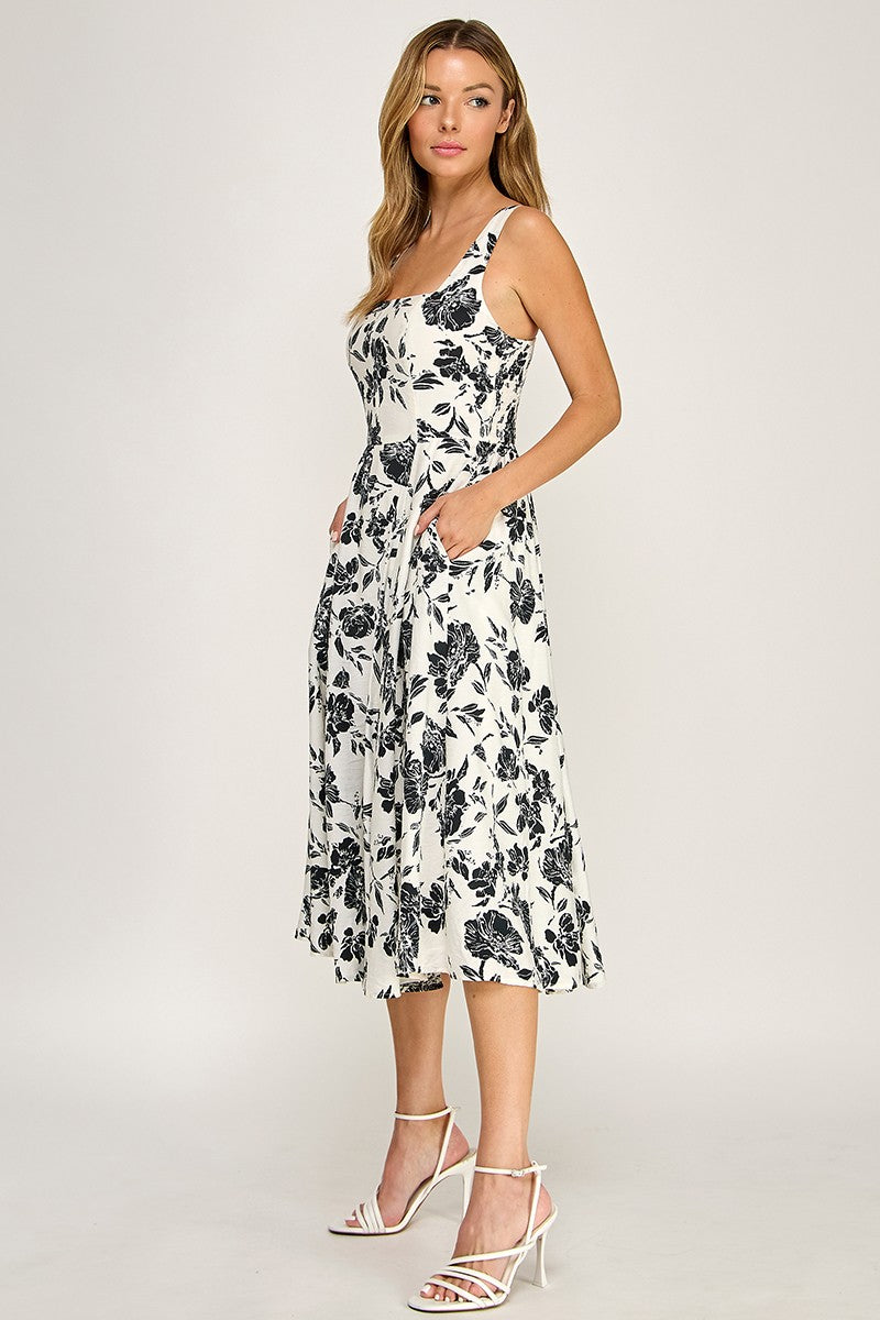 Woman wearing a floral dress on a white background