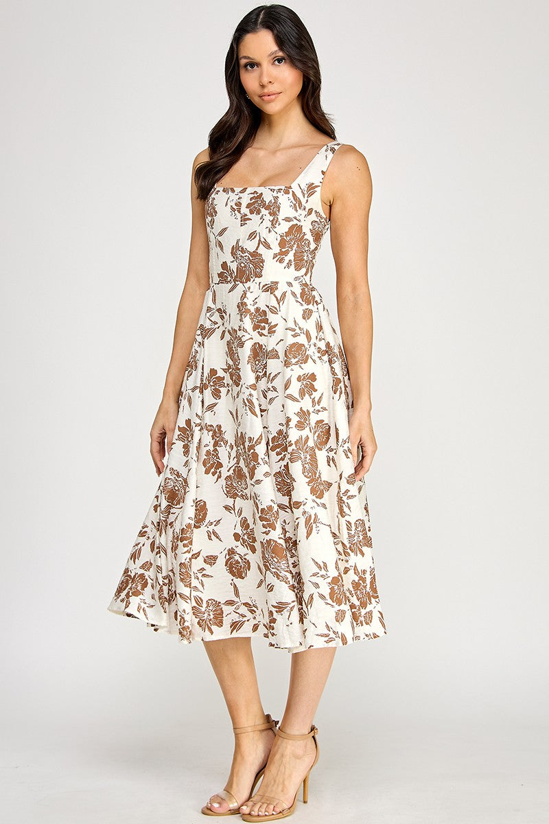 Woman wearing a floral dress on a white background