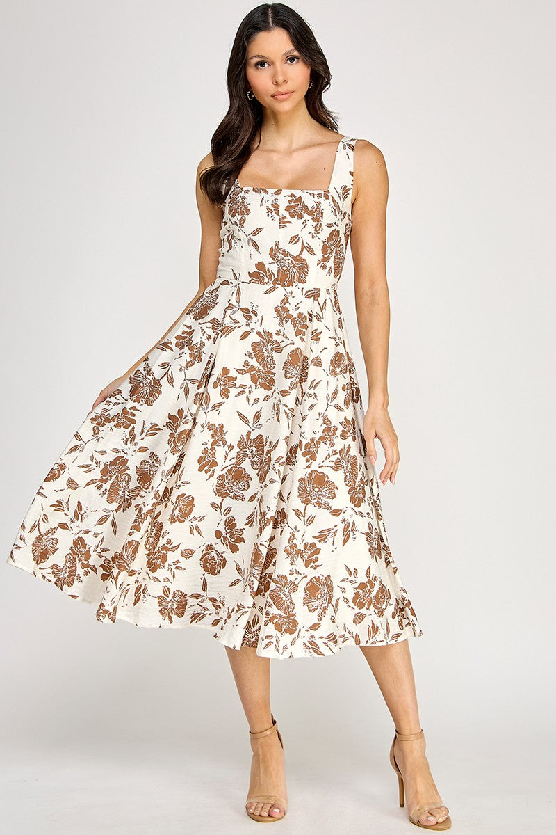 Woman wearing a floral dress on a white background