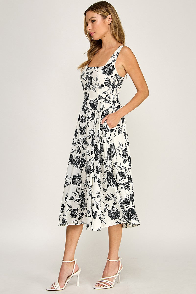 Woman wearing a floral dress on a white background