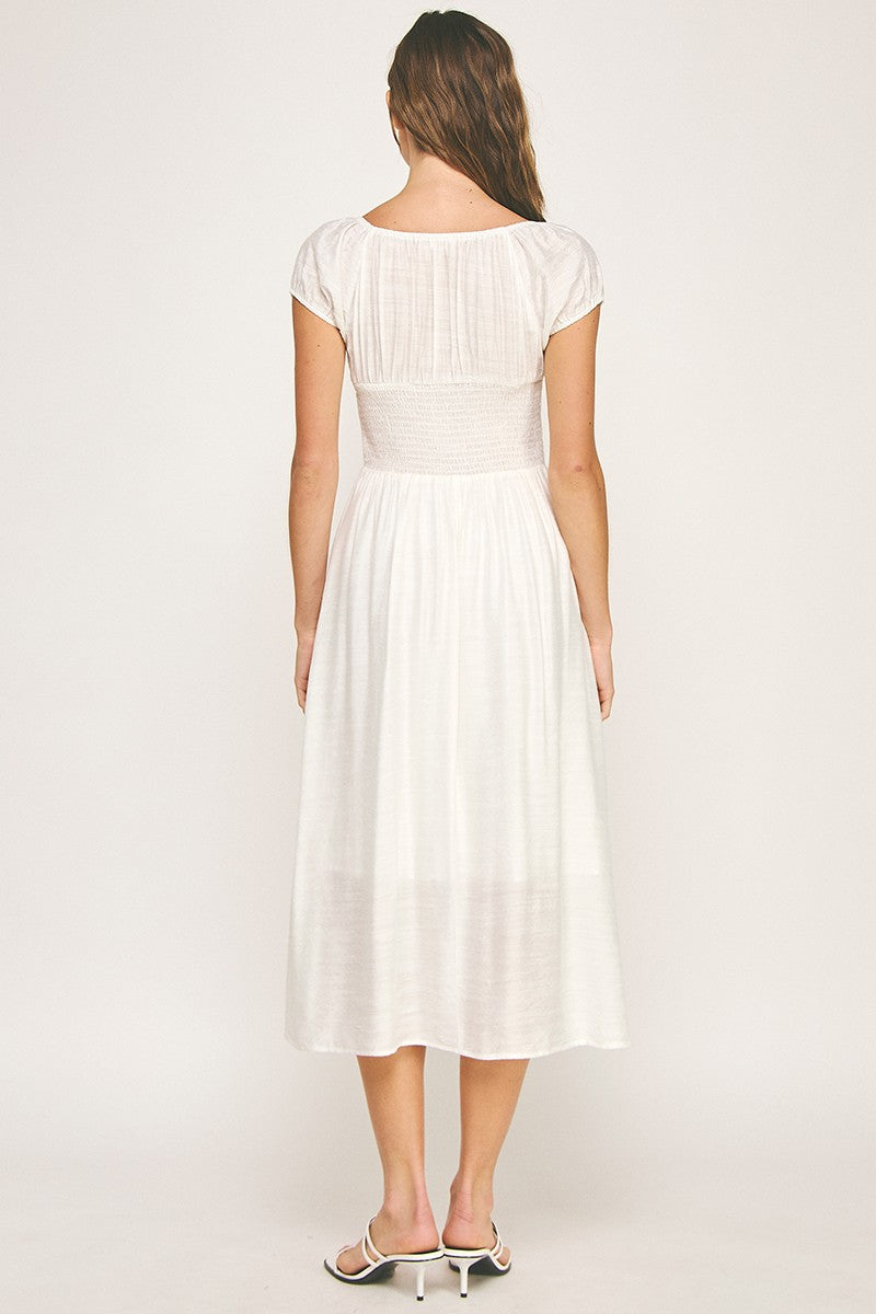 Woman wearing a dress on a white background