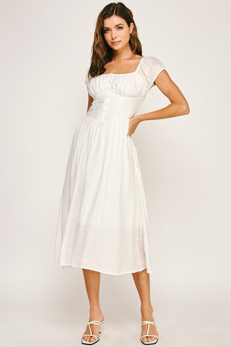 Woman wearing a dress on a white background