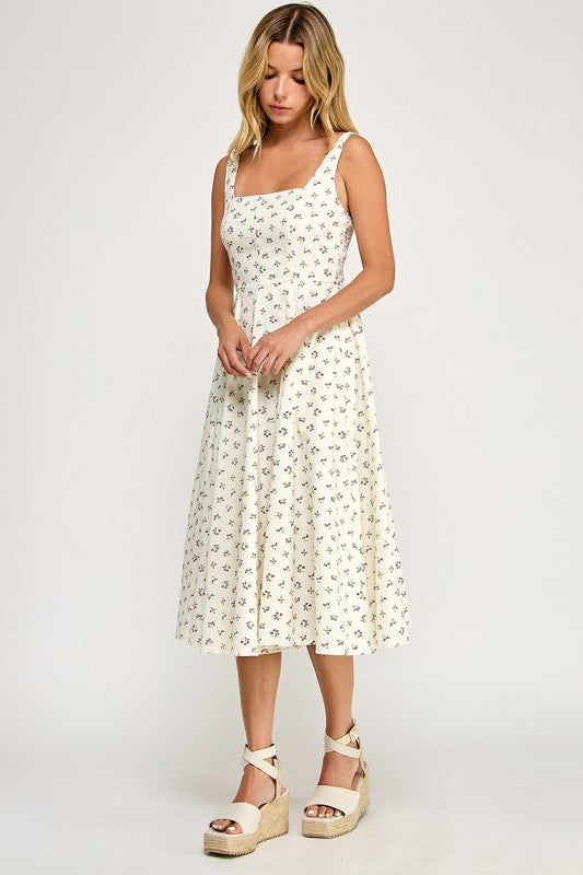 Woman wearing a floral dress on a white background