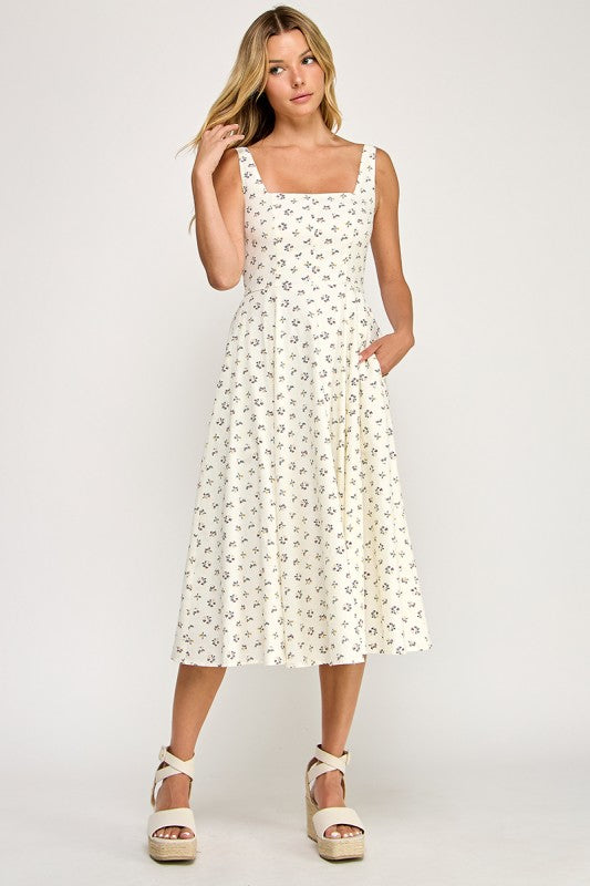 Woman wearing a floral dress on a white background