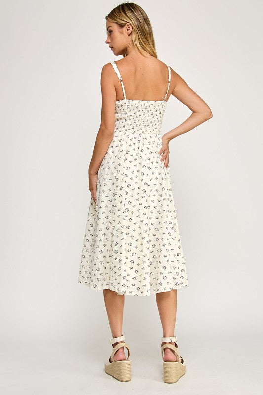 Woman wearing a floral dress on a white background