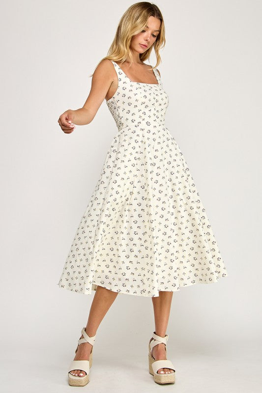 Woman wearing a floral dress on a white background