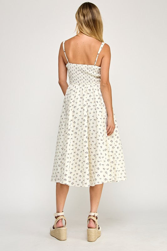Woman wearing a floral dress on a white background