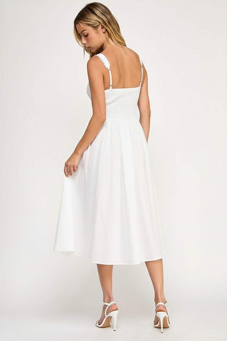 Woman wearing a sleeveless dress on a white background