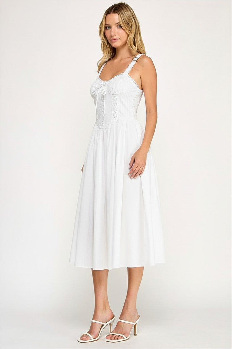 Woman wearing a sleeveless dress on a white background