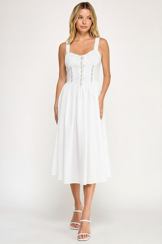 Woman wearing a sleeveless dress on a white background