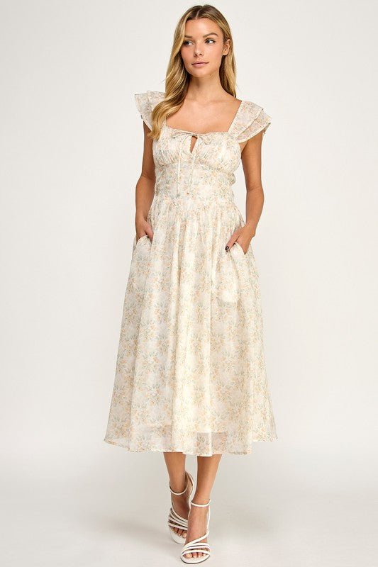 Woman wearing a floral dress on a white background