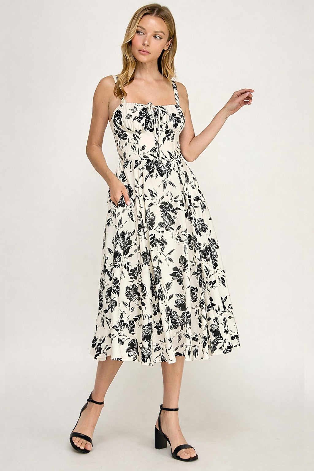 Woman wearing a floral dress on a white background