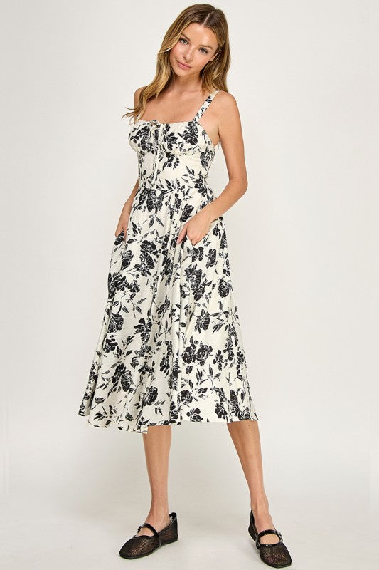 Woman wearing a floral dress on a white background