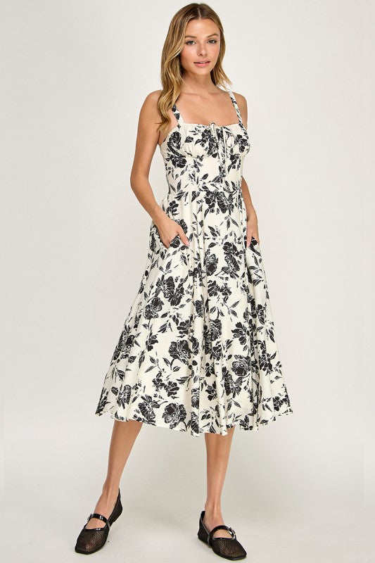 Woman wearing a floral dress on a white background