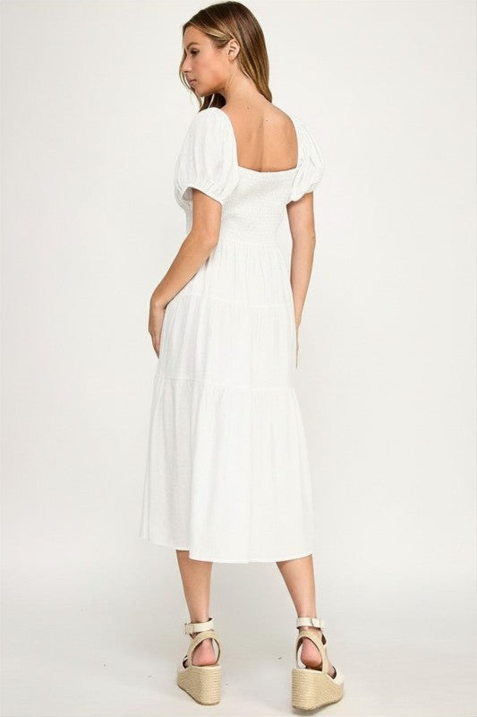 Woman wearing a dress on a white background