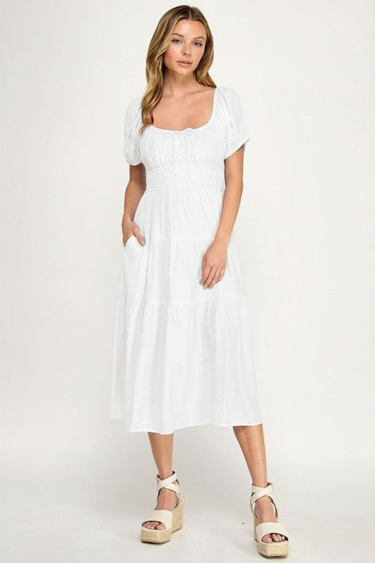 Woman wearing a dress on a white background