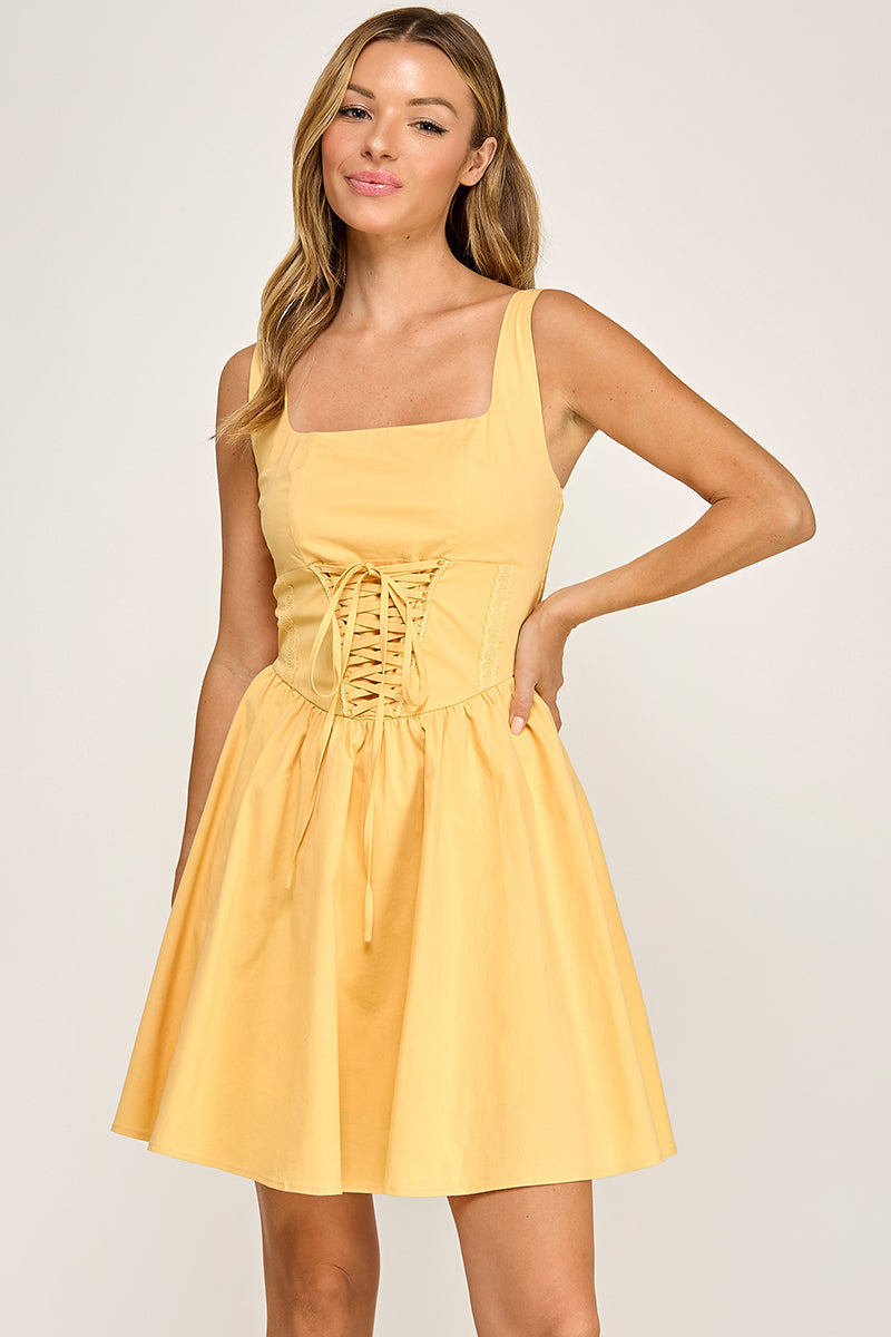 Woman wearing a dress on a plain background