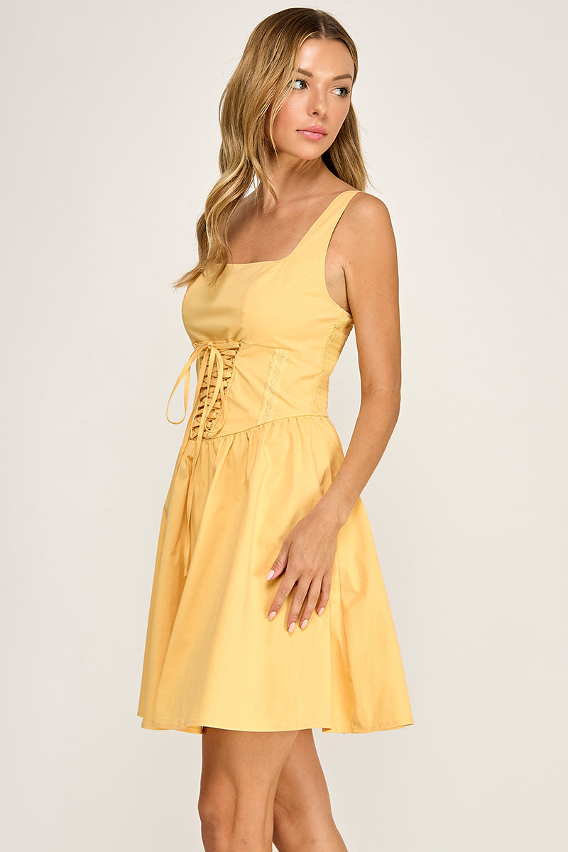 Woman wearing a dress on a plain background