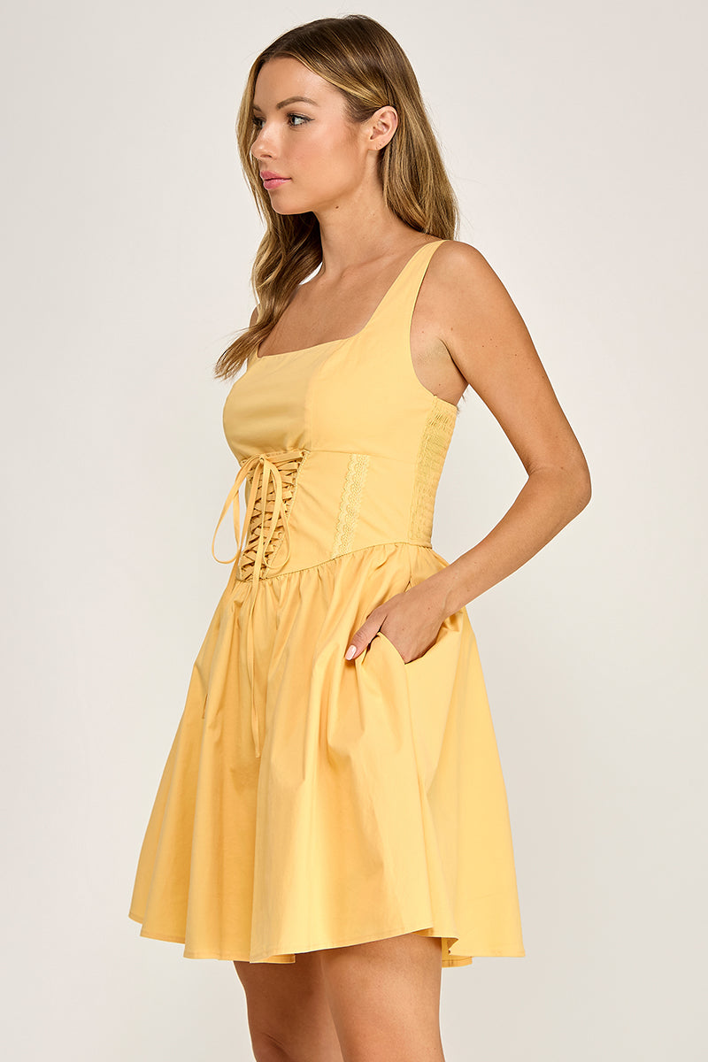 Woman wearing a dress on a plain background