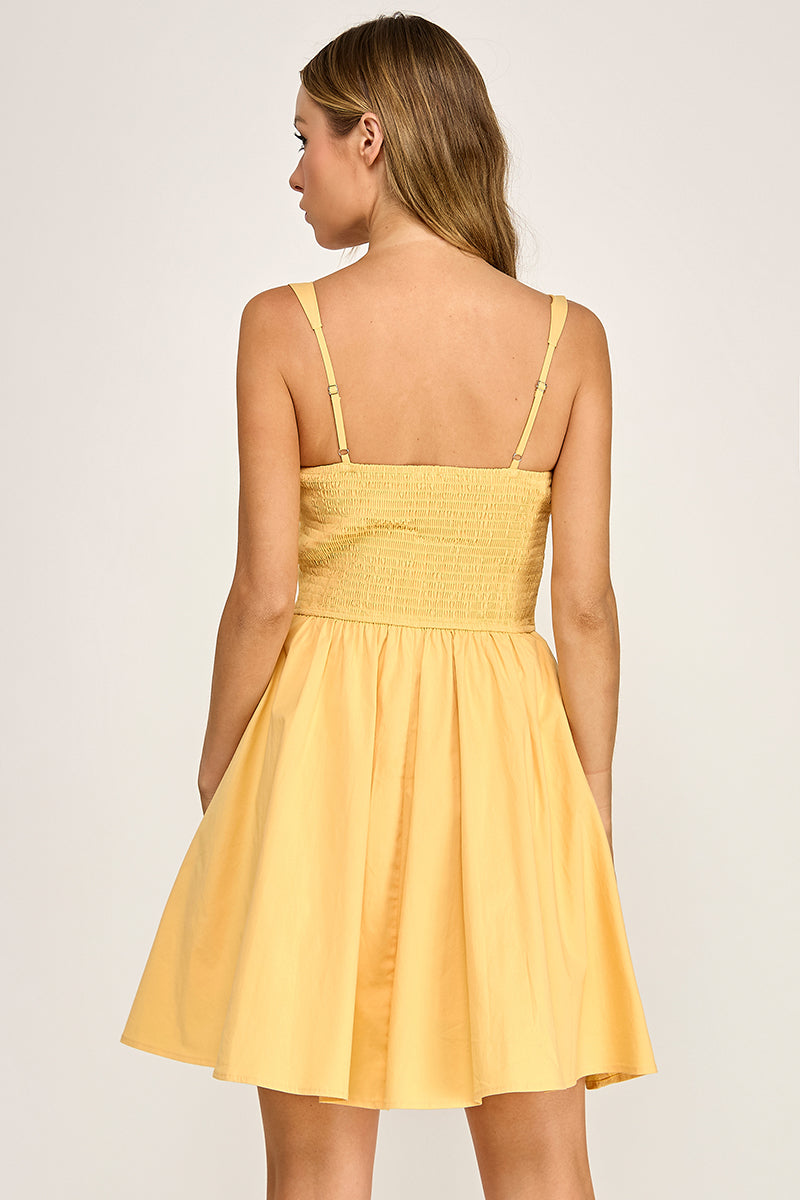 Woman wearing a dress on a plain background