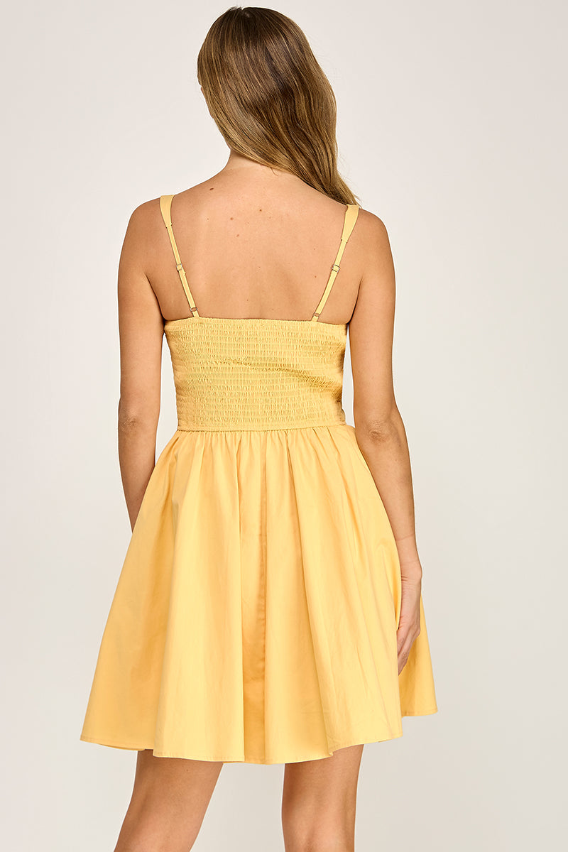 Woman wearing a dress on a plain background