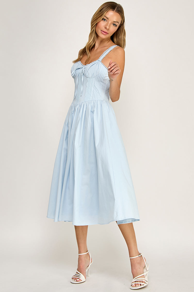 Woman wearing a sleeveless dress on a white background