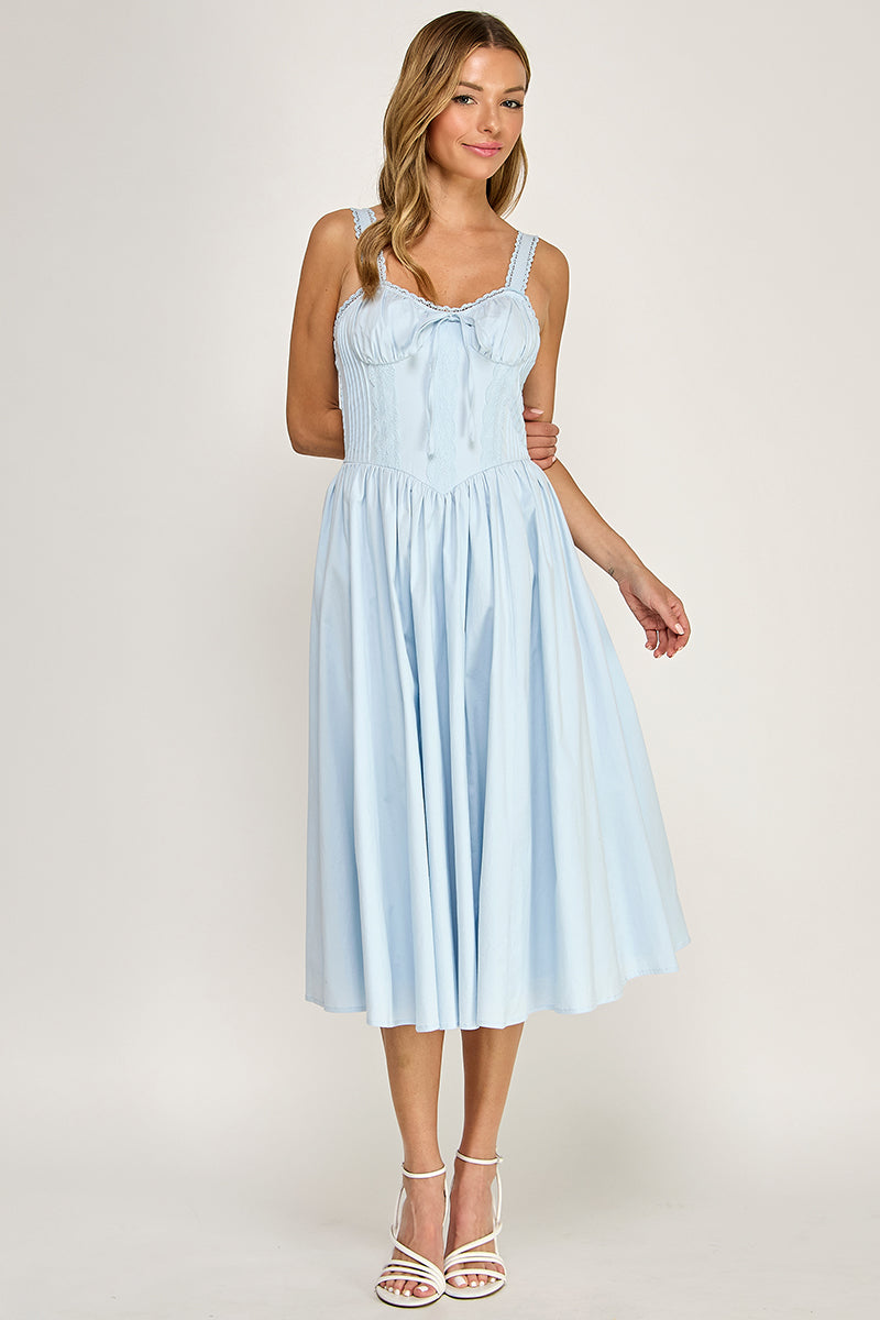 Woman wearing a sleeveless dress on a white background