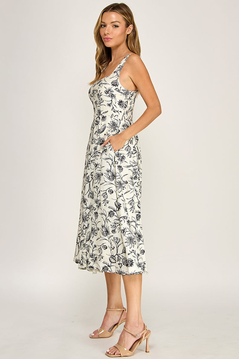 Woman wearing a floral dress on a white background