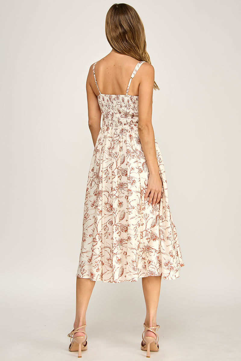 Woman wearing a floral dress on a white background