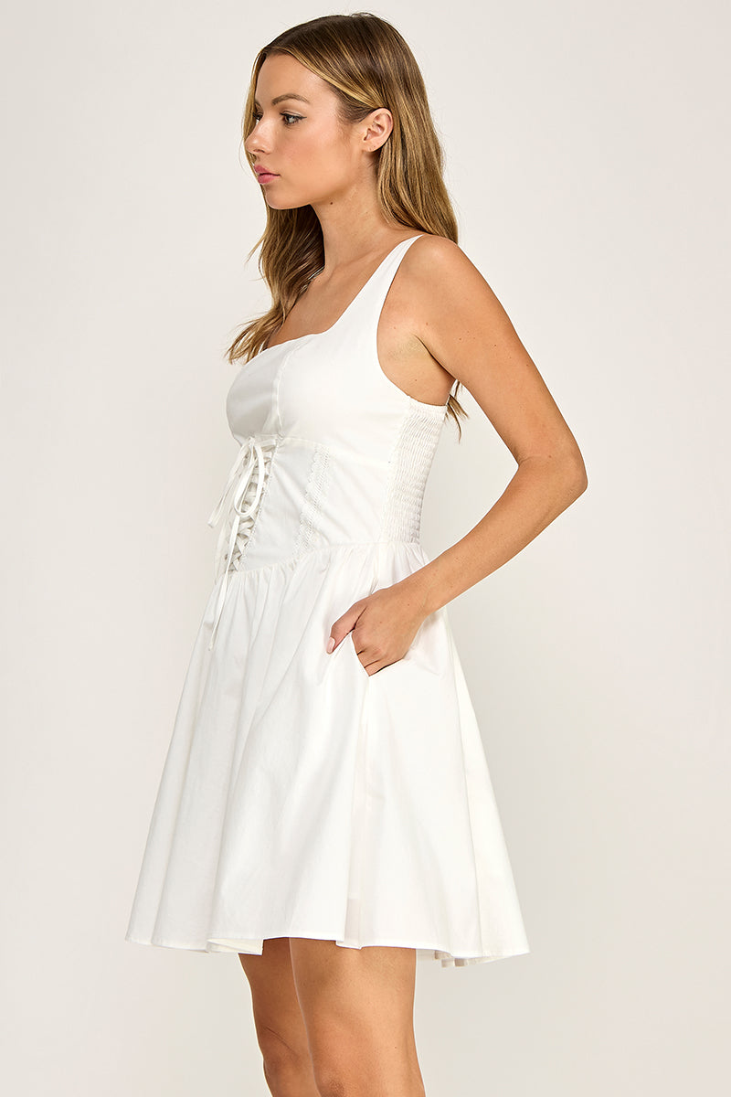 Woman wearing a dress on a plain background