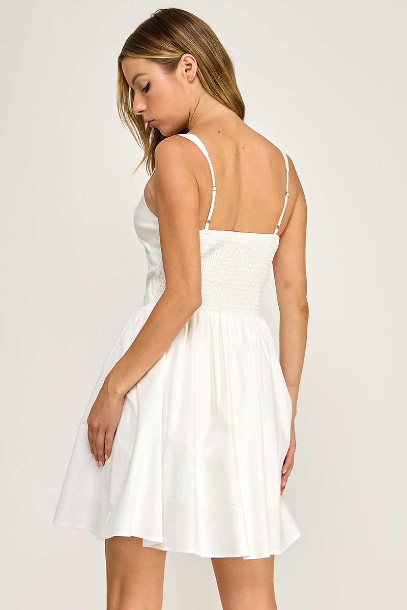 Woman wearing a dress on a plain background