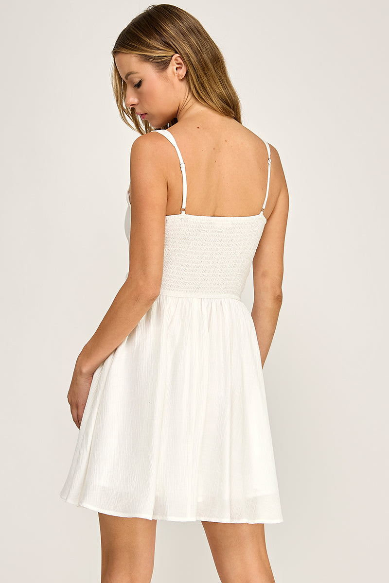 Woman wearing a dress on a white background