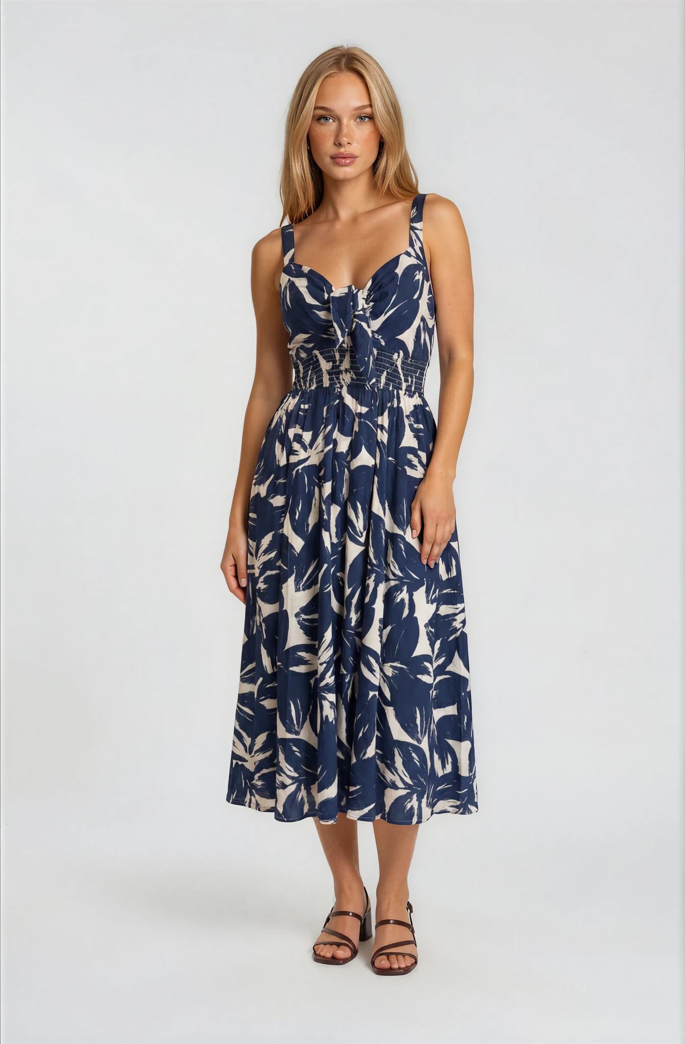 Woman wearing a floral dress on a white background