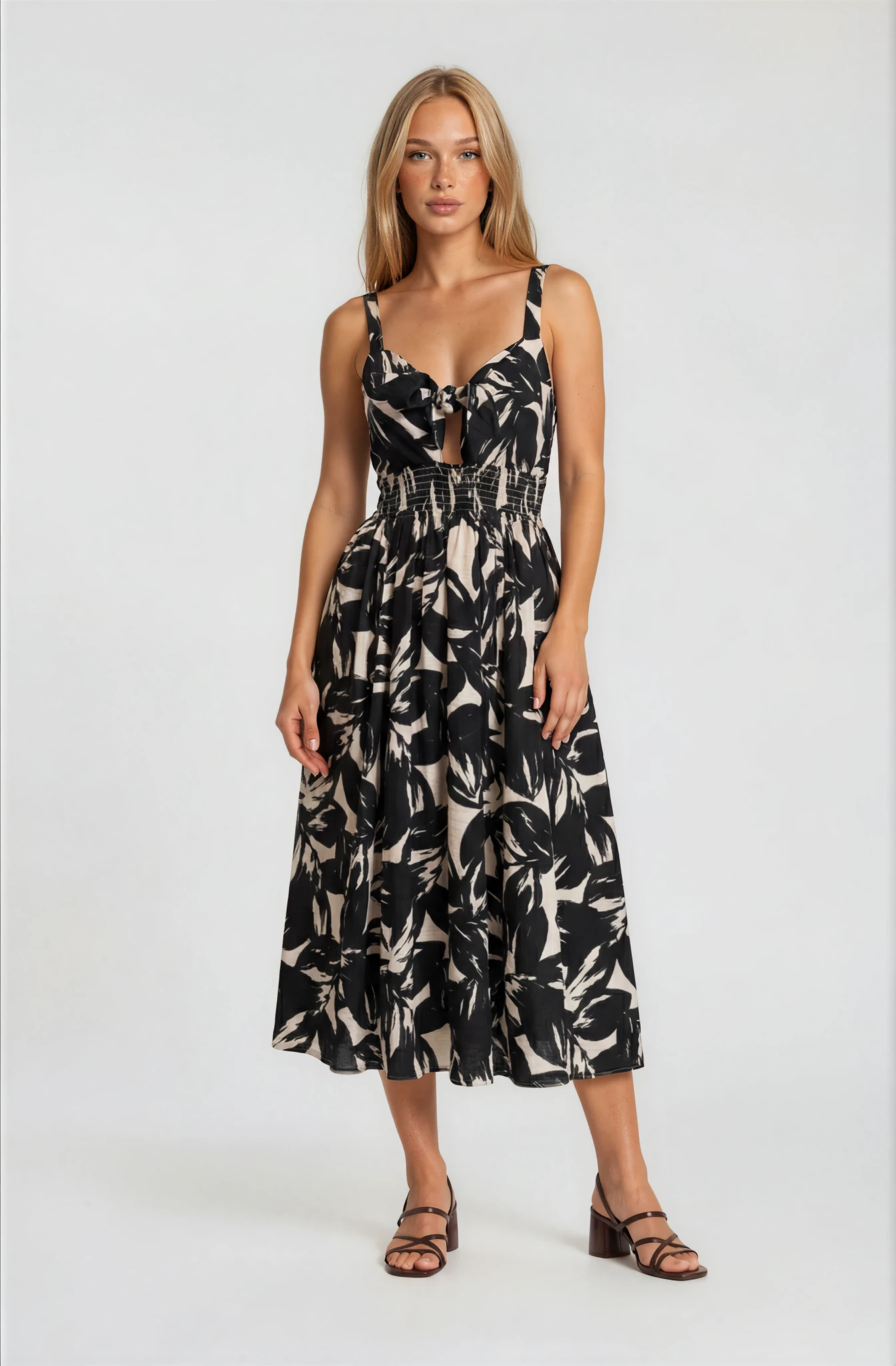 Woman wearing a floral dress on a white background